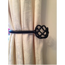 A Pair of Black Hand Made Wrought Iron Ball Cage Tie Backs